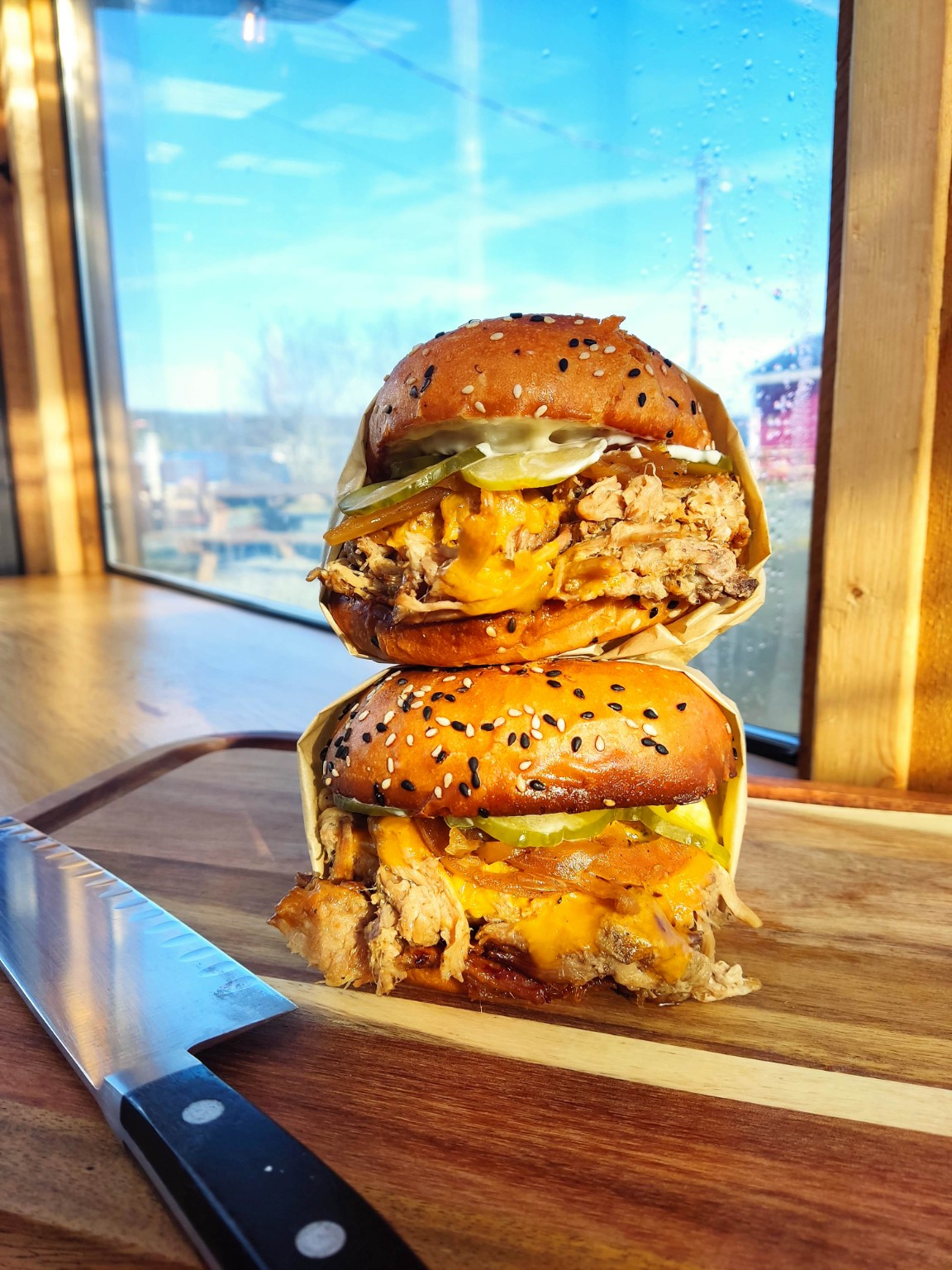 Two pulled pork sandwiches ready to serve